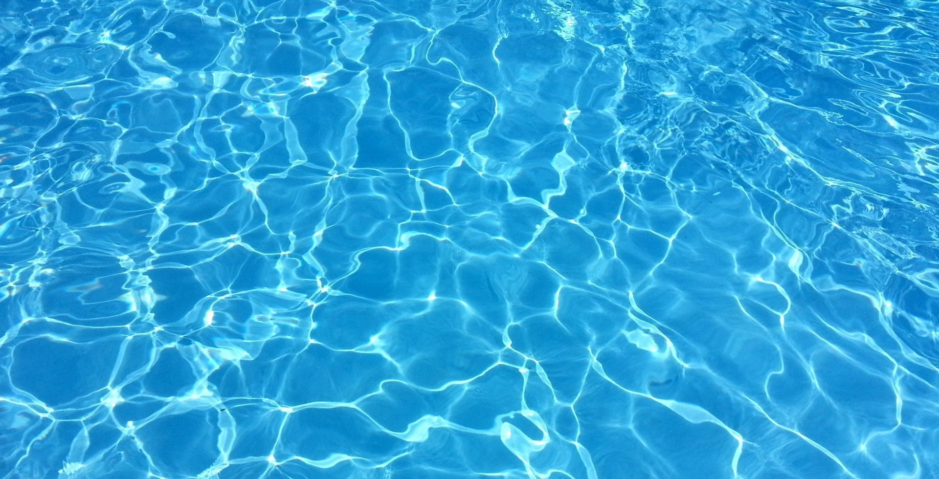 A swimming pool's water surface and reflecting light at Sunway Hotel Big Box
