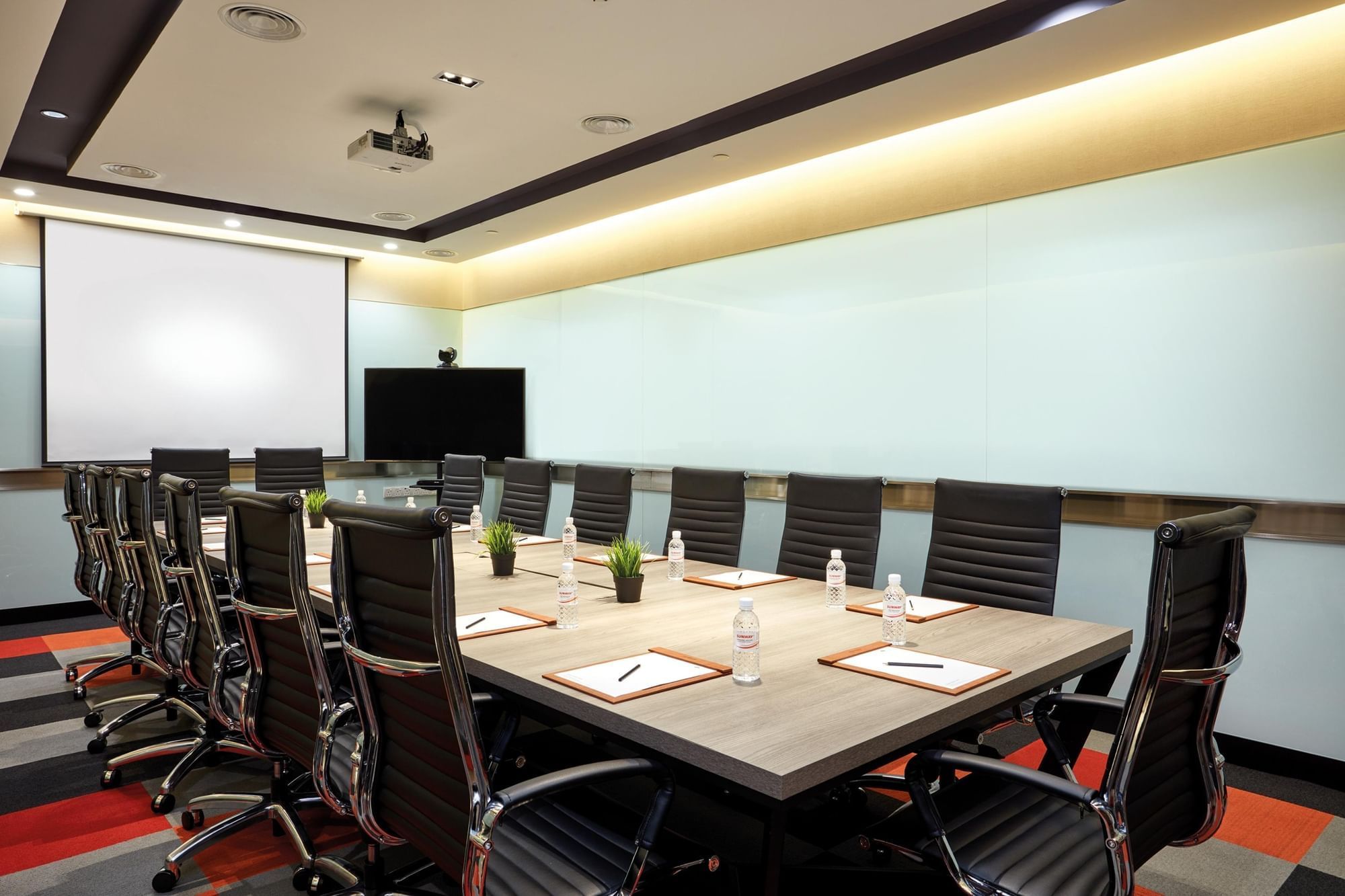 Boardroom set-up with digital screen in a meeting room at Sunway Velocity Hotel