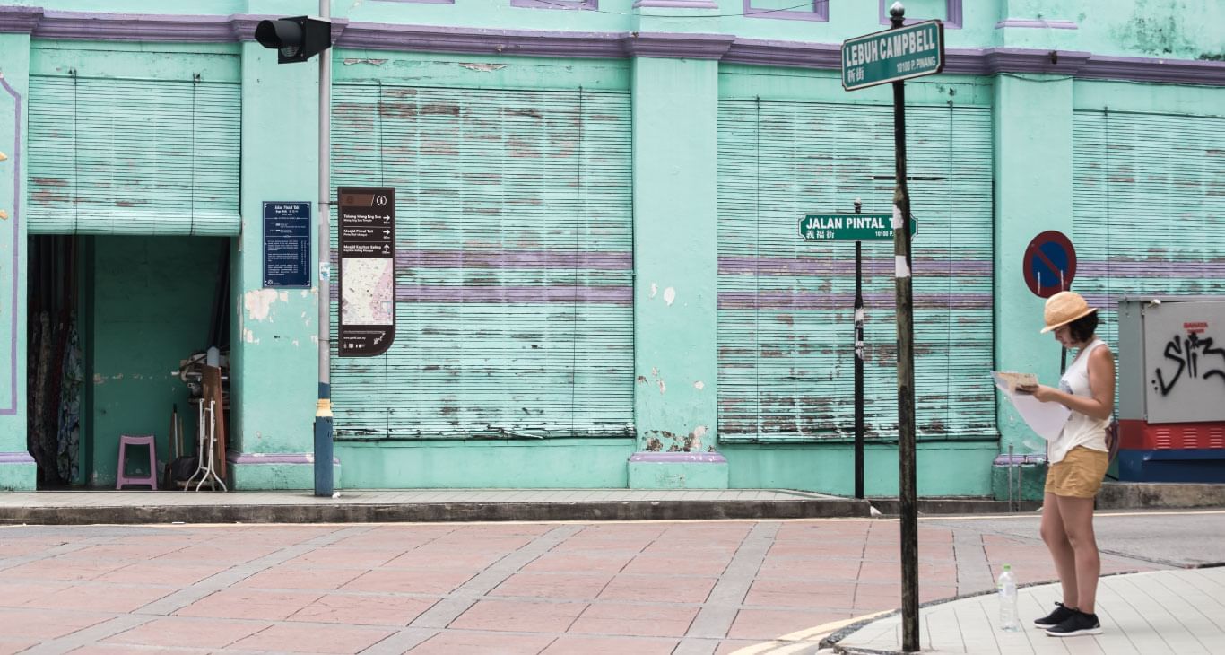 A person reviewing a map in George Town Penang near Sunway Hotel Seberang Jaya