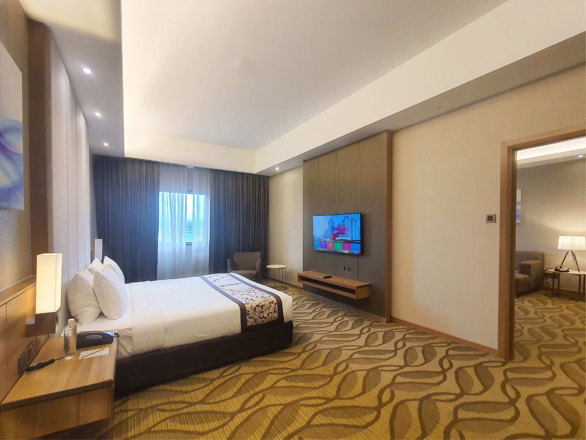 Comfy bed and TV in Executive Suites at Sunway Putra Hotel