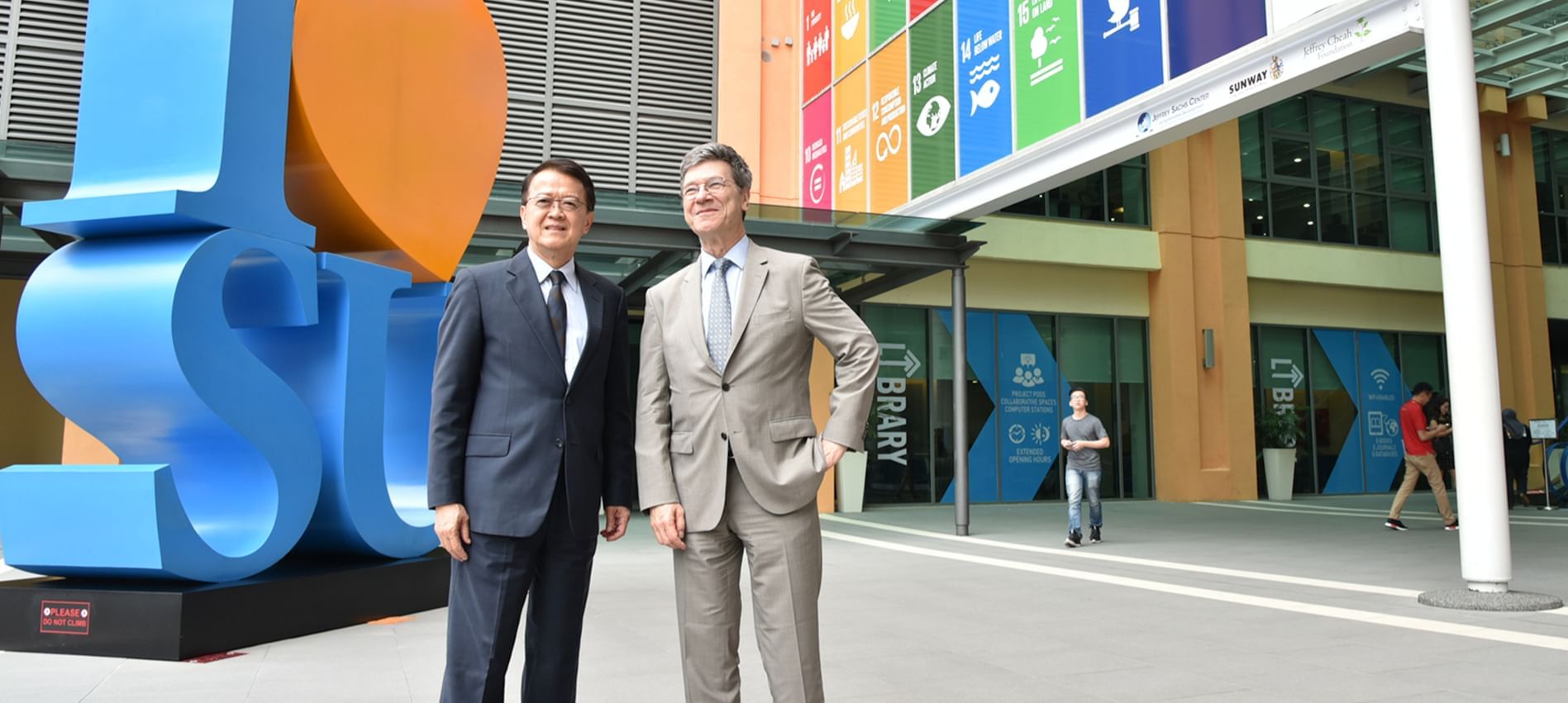 2 gentlemen posing at Jeffrey Sachs Centre near Sunway Lagoon