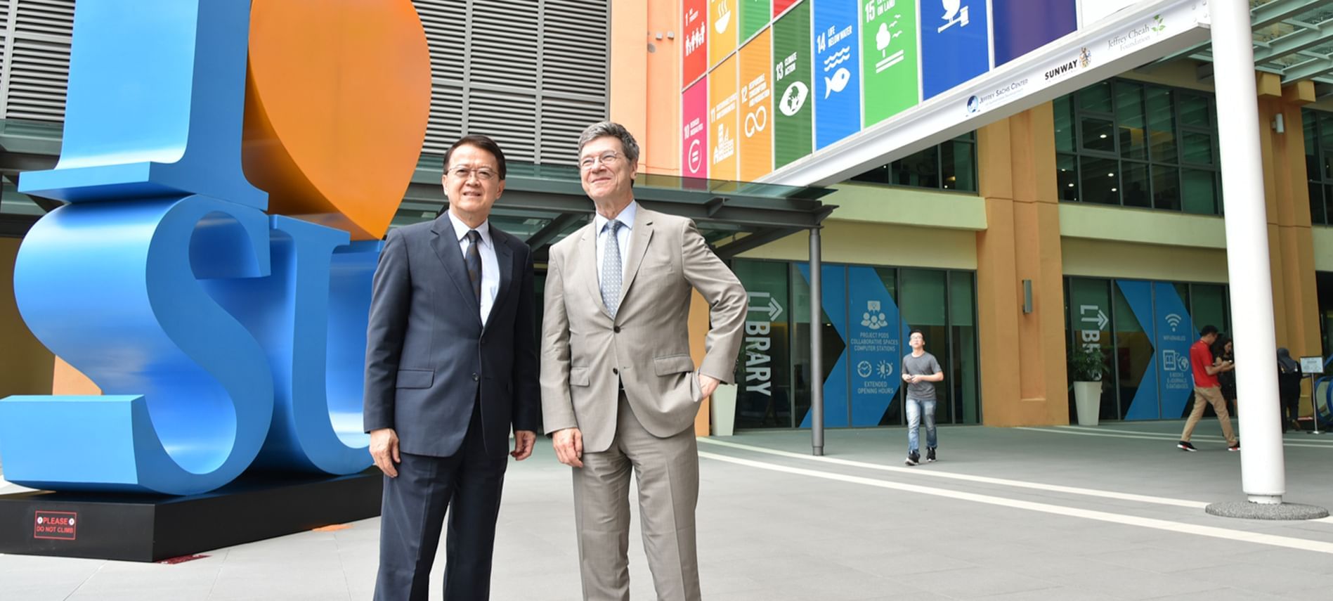 2 gentlemen posing at Jeffrey Sachs Centre near Sunway Resort