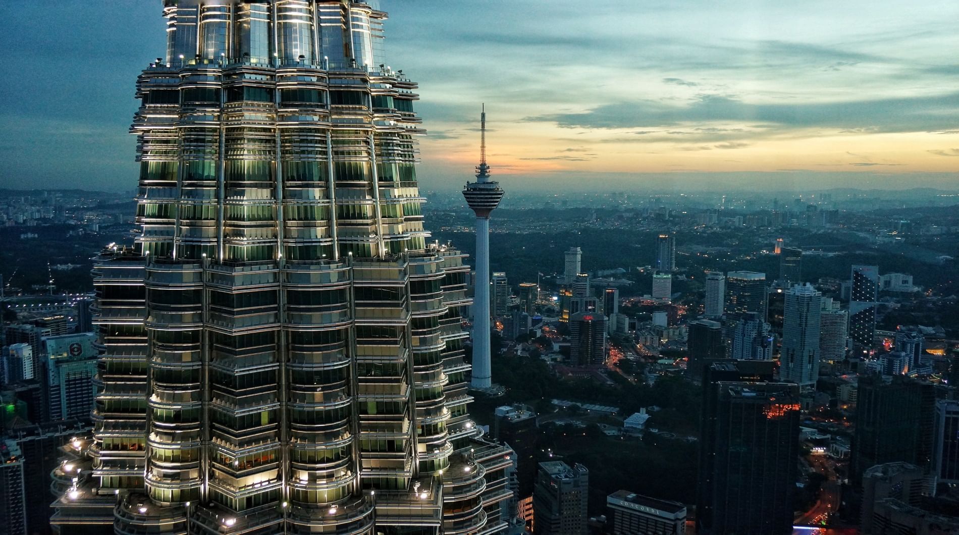 Close-up of a Petronas Twin Towers with a cityscape view near Sunway Velocity Hotel
