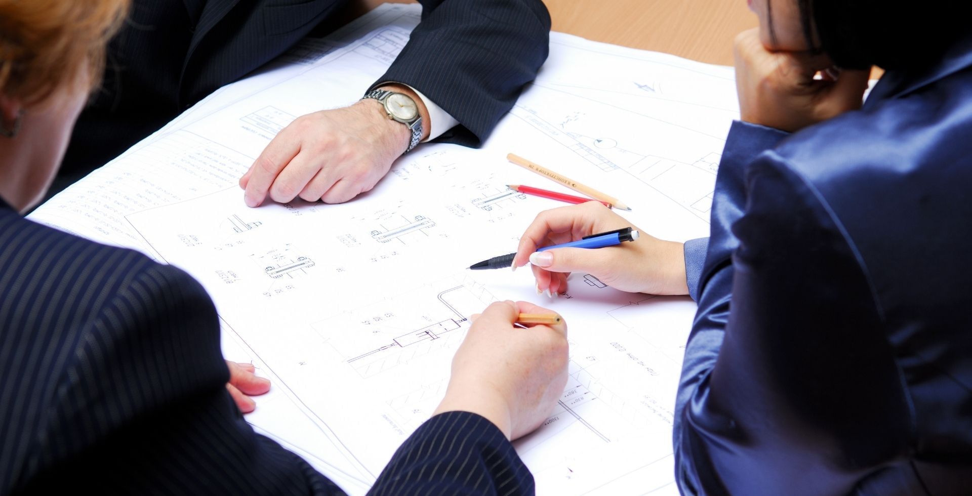 A team scheduling while surrounded by office supplies at Sunway Hotel Big Box