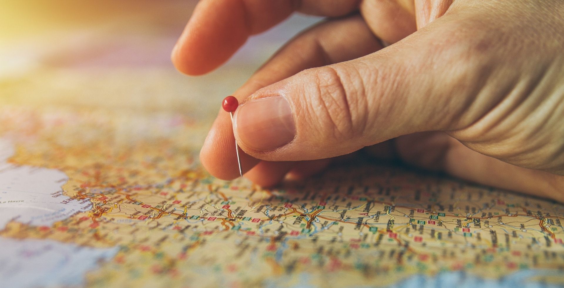 A hand points to a pin on a map, marking a location at Sunway Hotel Big Box