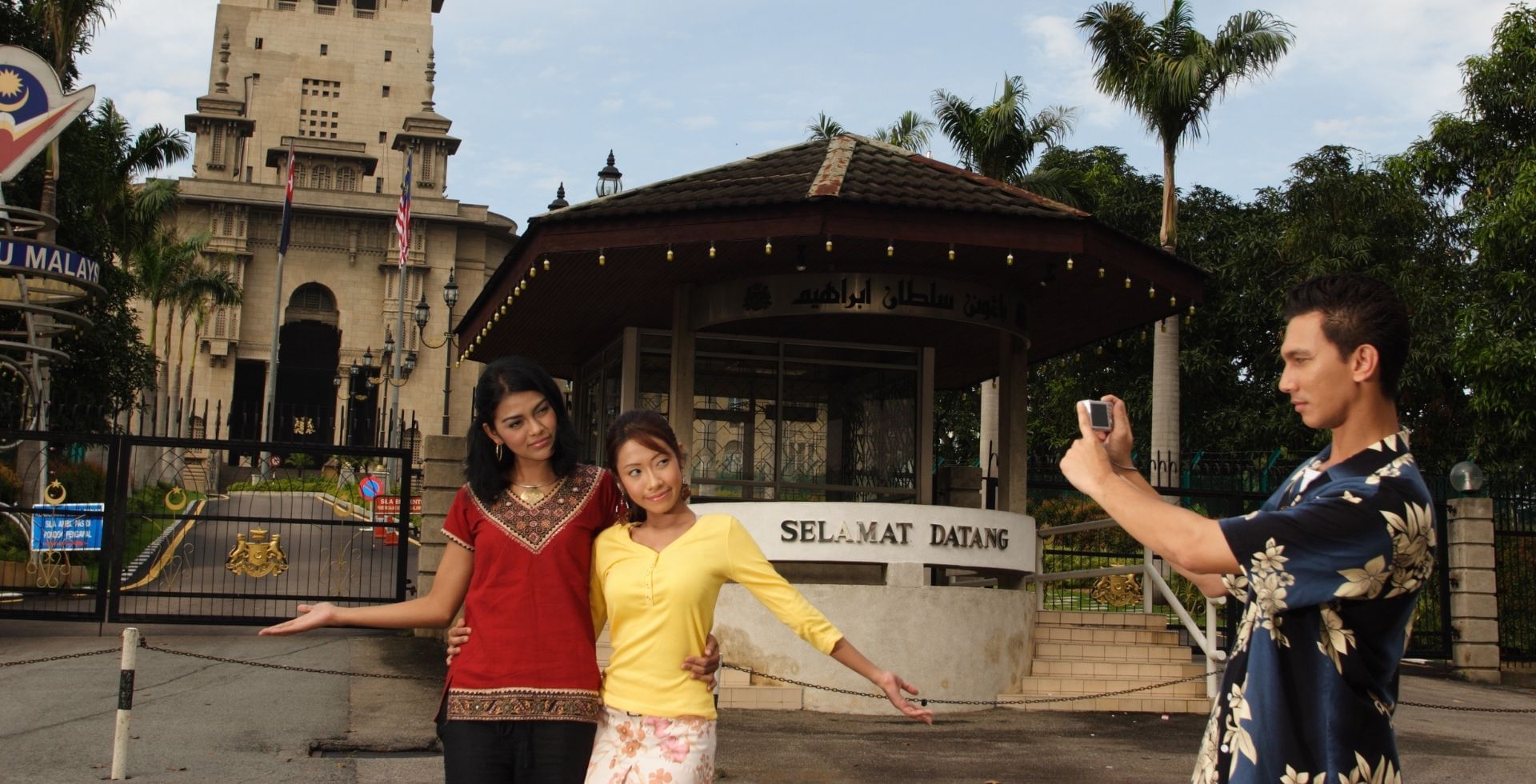 A family joyfully capturing a photo near Sunway Hotel Big Box