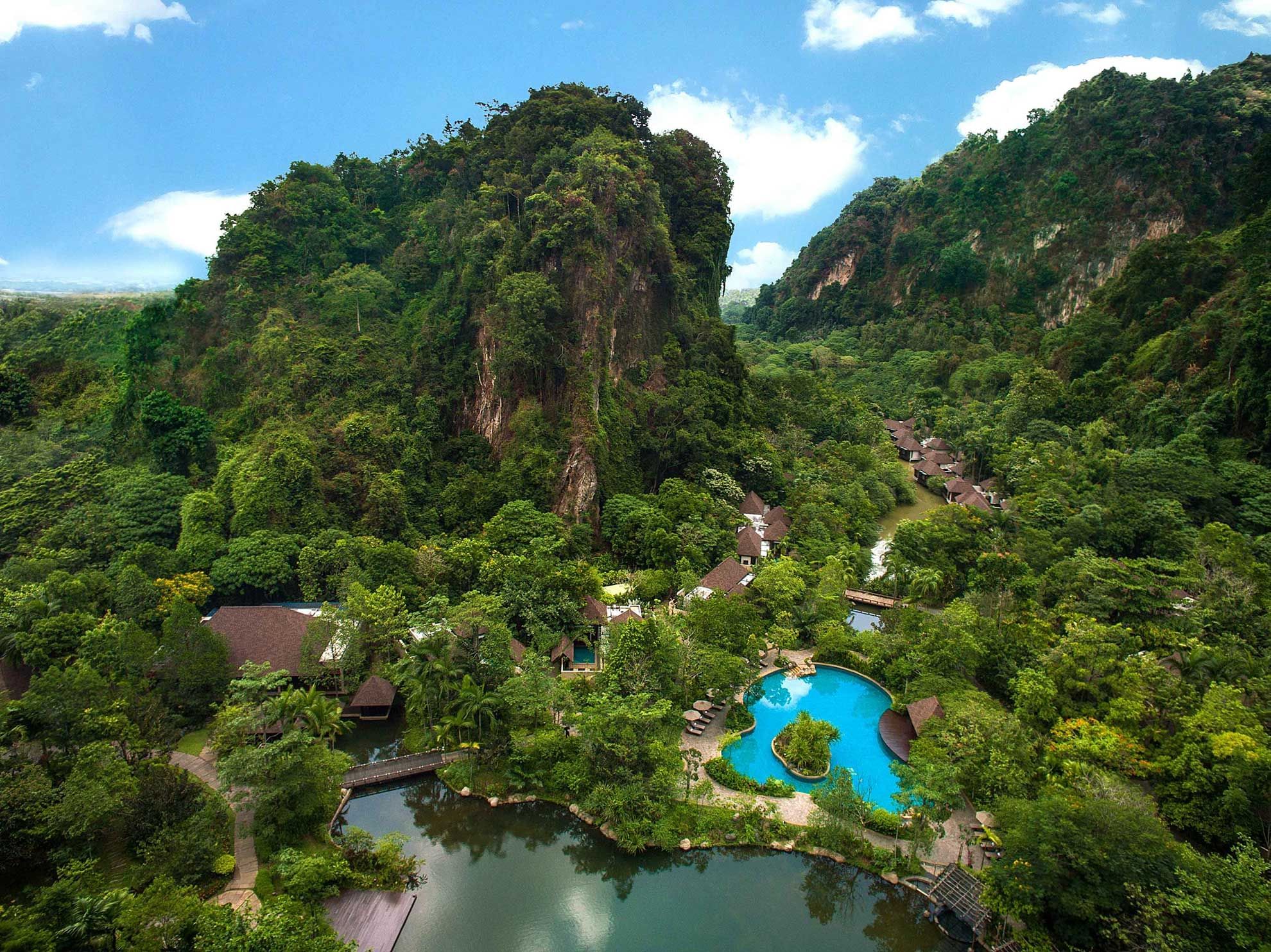 Aerial view of the pool surround by trees in The Banjaran Hotsprings Retreat