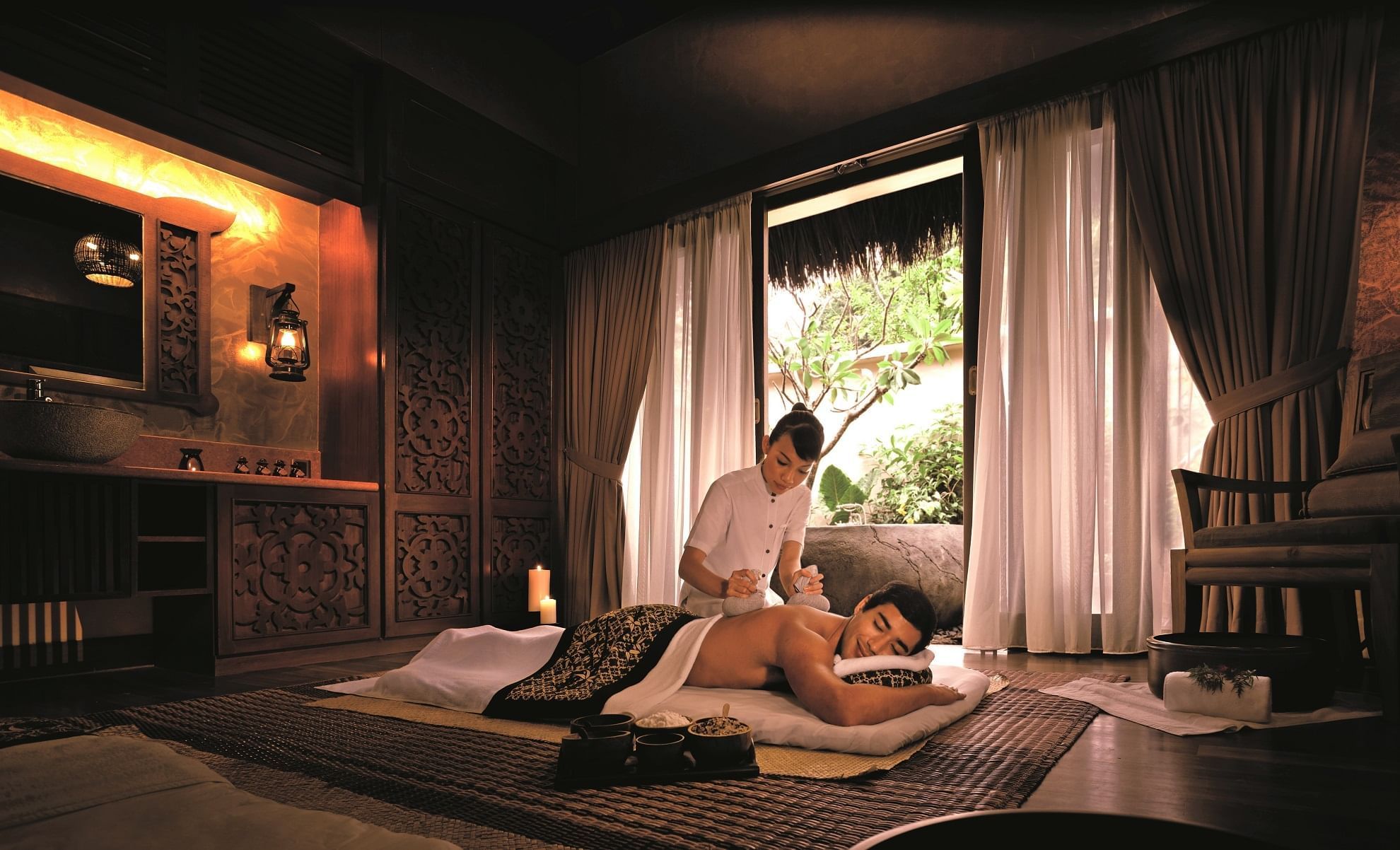 Man receiving a massage in the Wellness spa at The Banjaran Hotsprings Retreat