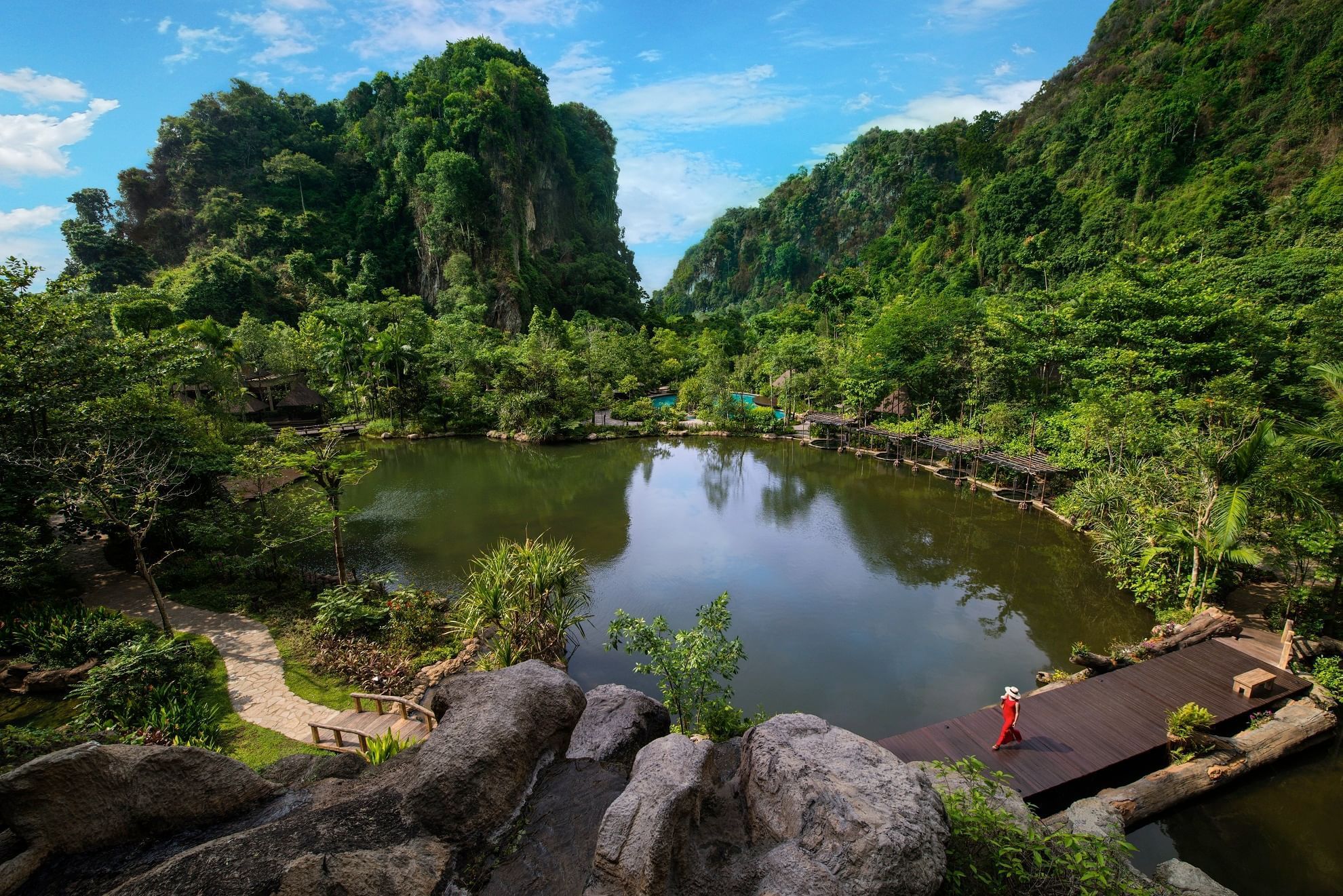 Distant view of the pool surround by trees in The Banjaran Hotsprings Retreat
