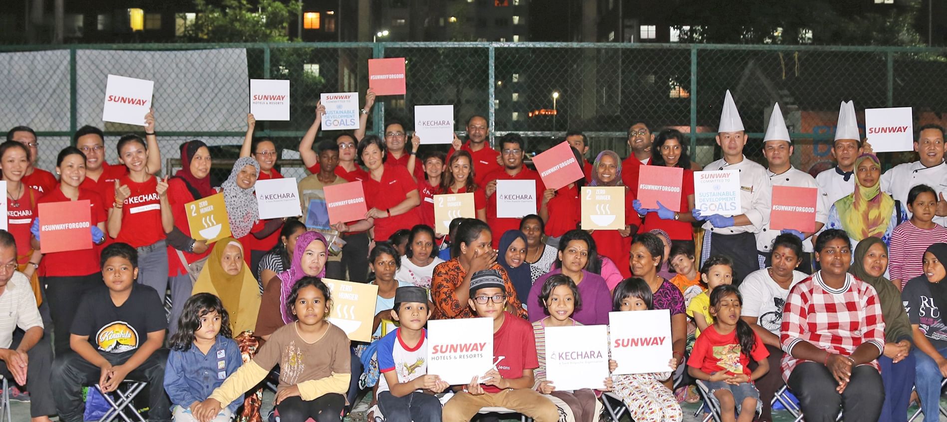 Group of kids holding SUNWAY boards & posing at Sunway Lagoon
