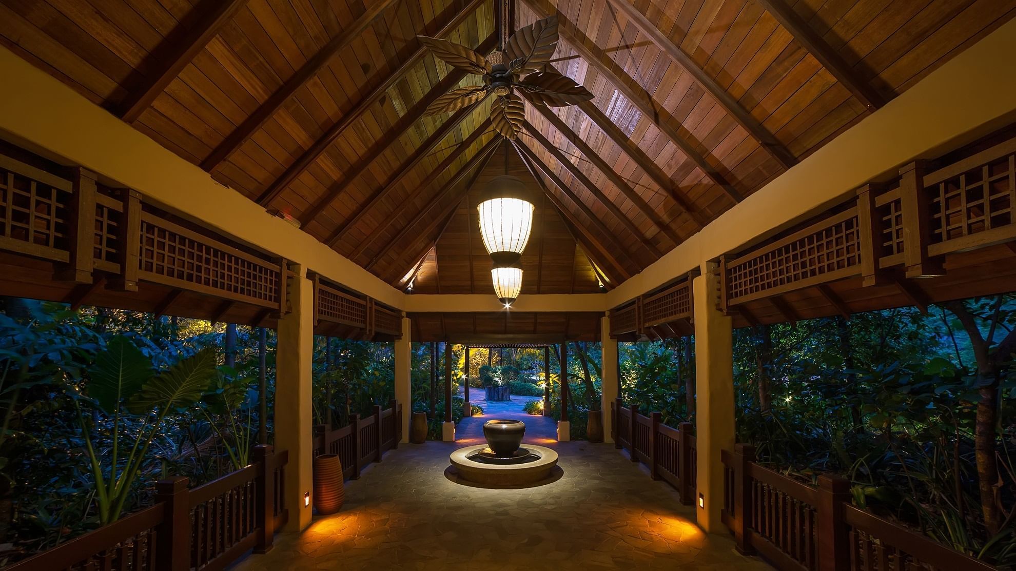 Open reception area with a fountain at The Banjaran Hotsprings Retreat