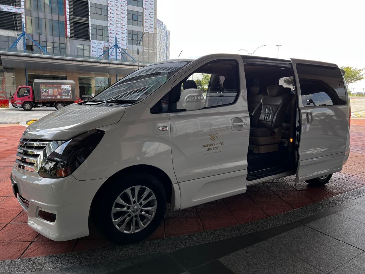Luxury Hyundai ix35 Cab parked in front of the Sunway Hotel Big Box
