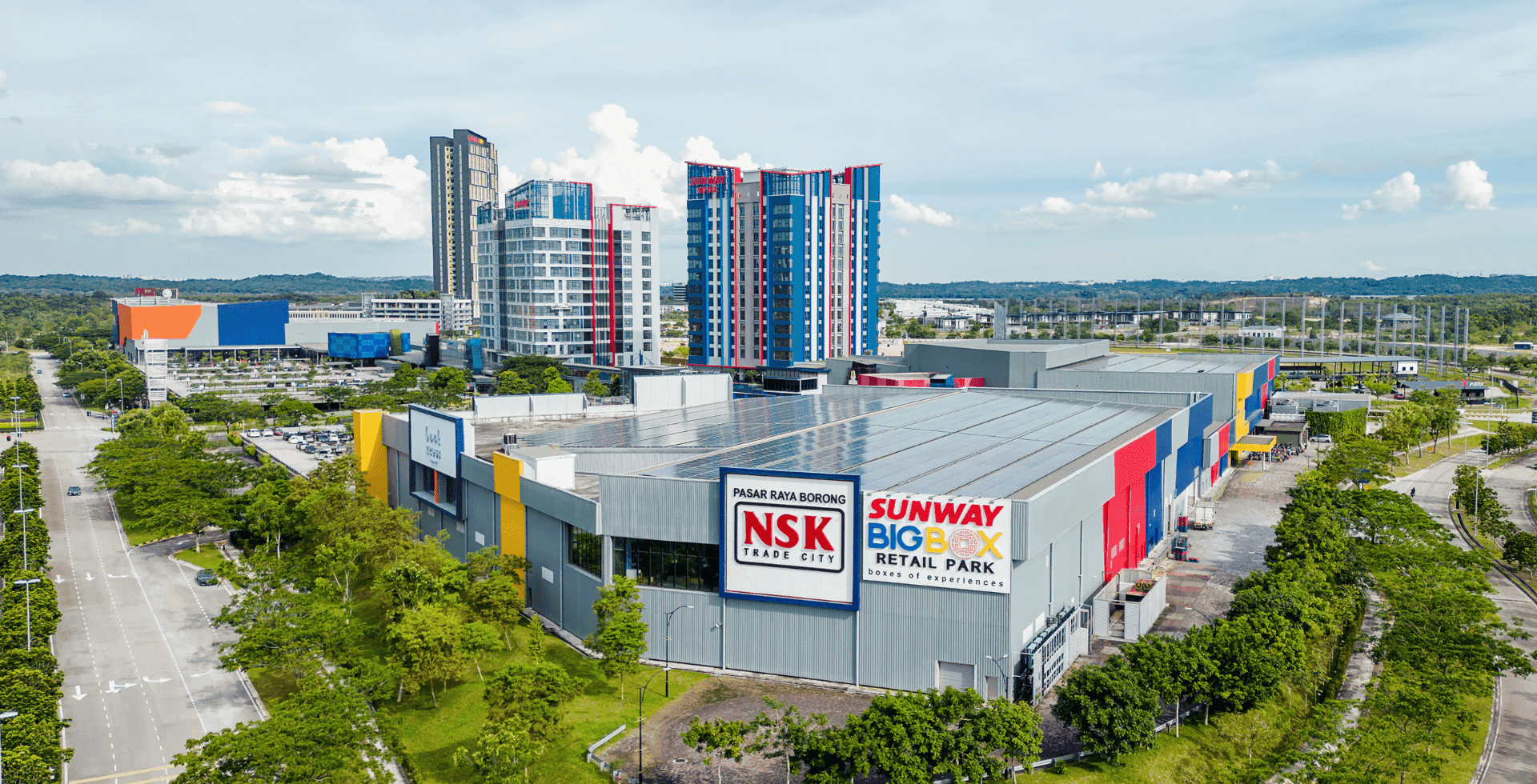 Aerial view of the city and the Sunway Hotel Big Box on a sunny day